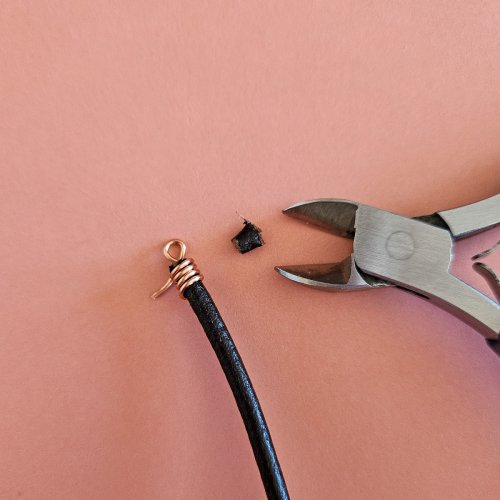 Margot Potter's Falloween Bracelet  - , Contemporary Wire Jewelry, Dapping, Dapping Jewelry, Findings, Clasps, Components, Wire Wrapping, Wrapping, Wire Wrapping Jewelry, Use flush cutters to trim the leather even with the coil.    